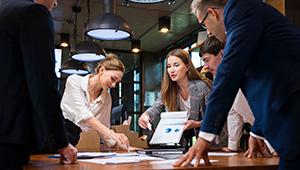 Group of professional workers in conference room