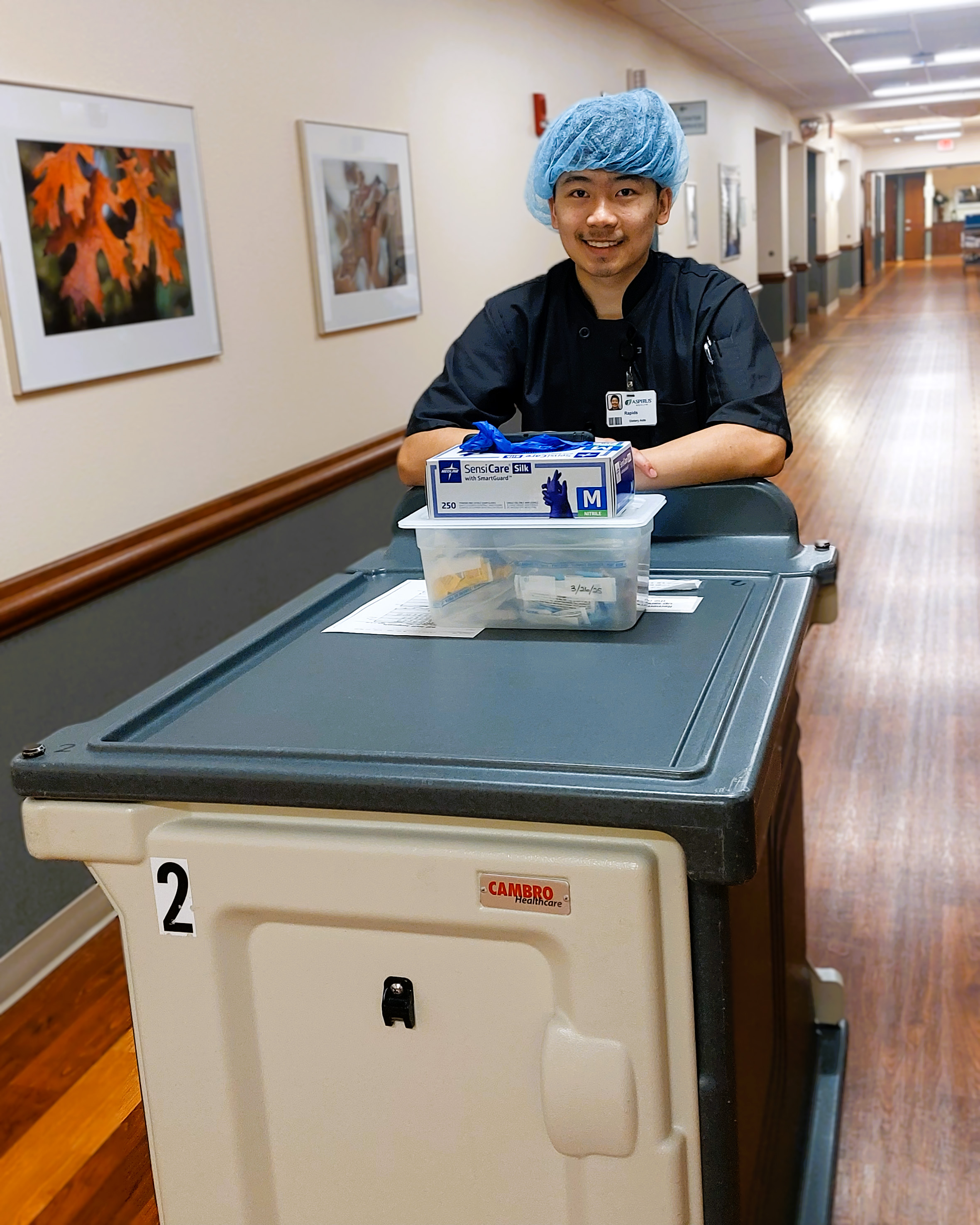Rapids smiles from behind his work station.