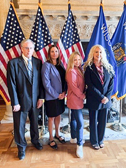 Staff representing DWD as Act 33 is signed