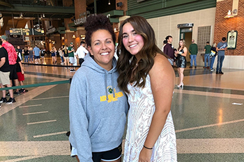 Jazmine Steinfeldt, shown with daughter Jaidyn, is wearing a WalkAide, which has helped her overcome a symptom of multiple sclerosis and continue working