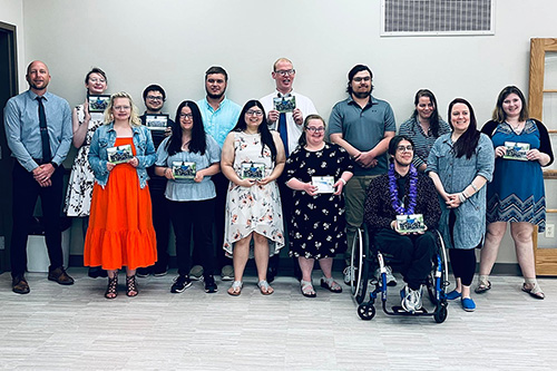 Graduates from the 2022 Mayo Clinic Eau Claire Hospital Project SEARCH class pose for a photo. Left to right: Instructor Tim Burns, Hannah Pierce, Emily Hurt, Daleyn Thomas, Amaiya Moua, Christian Jacobsen, Bryanna Troutz, Liam Caraher, Courtney Gadke, Matt Wolbert, Dorian Anderson, Instructor Rose Hinshaw, Instructor Erin Berdal, Molly Mundinac