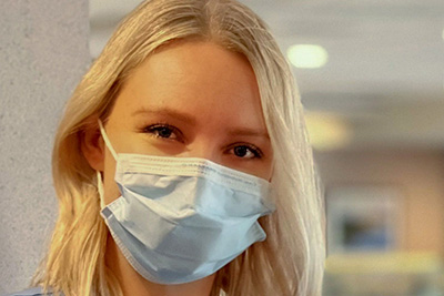 female nurse wearing a mask
