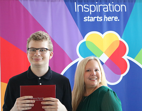 Brady Keefe is eager to start his new job as a cashier in the ThedaCare cafeteria. He was joined by DWD Secretary-designee Amy Pechacek at the recent ThedaCare Project SEARCH graduation event in Appleton.