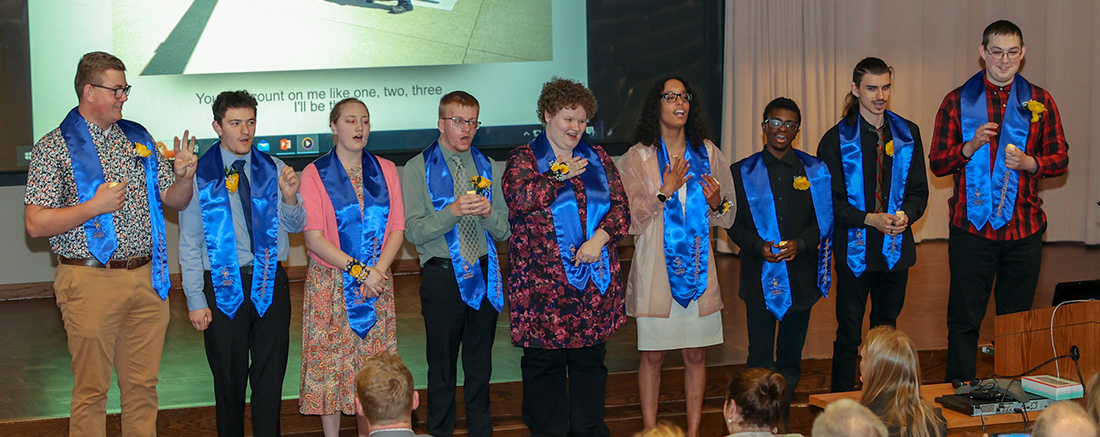 Graduates of Mercy Medical Center's 2023 Project SEARCH cohort celebrated the end of their internships with a little song and showmanship. Left to right are Carter Urban, Jonathan Cordova, Amelia Veldman, Kolin Schmitz, Jordan Strecker, Sierra Braxton, Myles Hill, Alejandro Mendieta, and Zachary Geb.