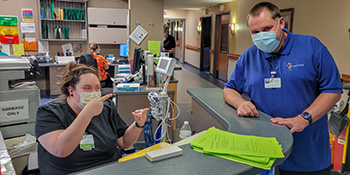 Jon Hackner, right, is a Project SEARCH intern and one of seven new Project SEARCH graduates from Rhinelander and Northland Pines High Schools. 