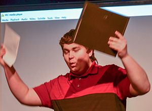 Nathaniel (Nate) Finnessy celebrates on stage at University of Wisconsin-Stevens Point after receiving his high school diploma and Project SEARCH certificate. 
