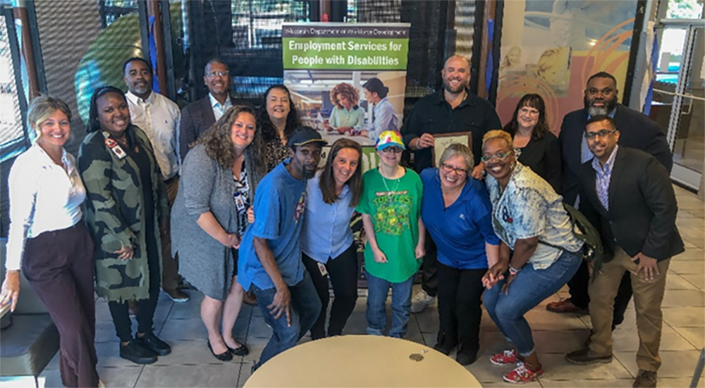 Representatives from DVR, SKCO McDonalds, and Goodwill Industries of Southeastern Wisconsin pose for a photo on Thursday, October 5, 2023, at the West Allis McDonalds following a ceremony recognizing SKCO McDonalds' dedication to hiring and retaining a diverse workforce. 