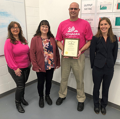 Conagra Brands in Beaver Dam was presented with Gov. Tony Evers' Exemplary Employer Award on Friday, Oct. 27, during National Disability Employment Awareness Month. The award is given to employers who demonstrate diverse and inclusive hiring practices. Pictured from left to right: Business Services Consultant Chantel Kilmer, DVR Administrator Delora Newton, Conagra Brands Facilities and Operations Manager Gary DeVries, and DVR Counselor Jesse DeAngelis.