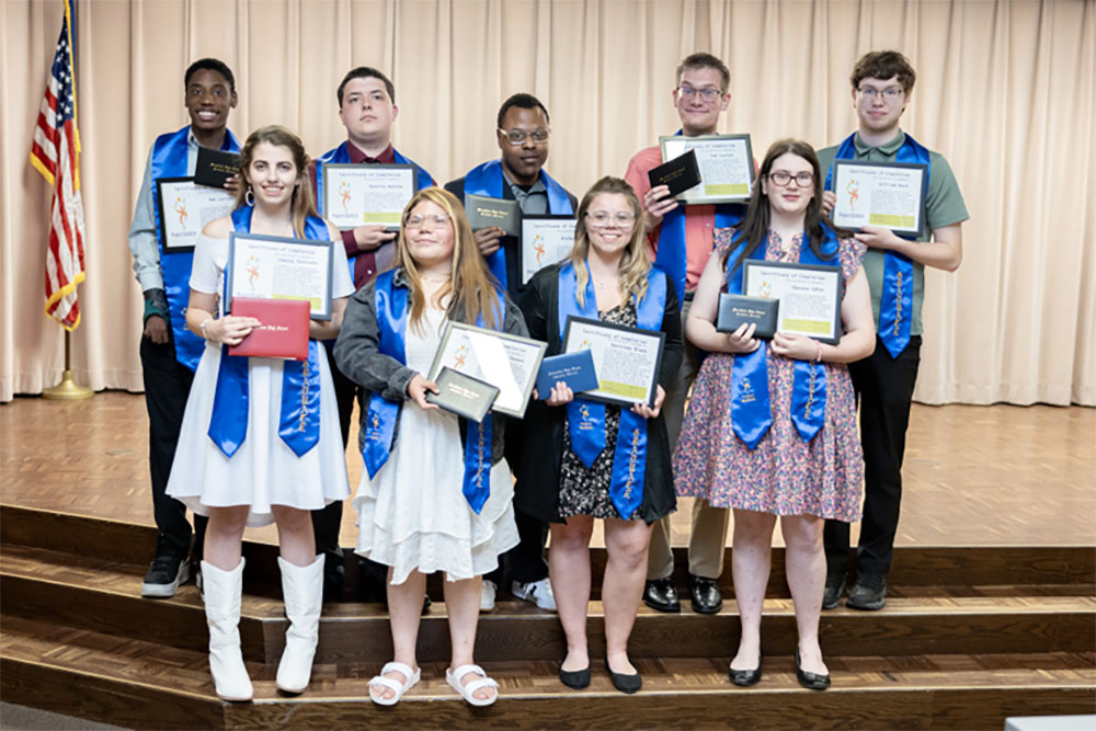 Project SEARCH graduates receiving diplomas