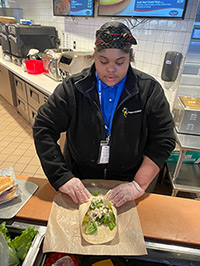 Sivohne Johnson prepping food