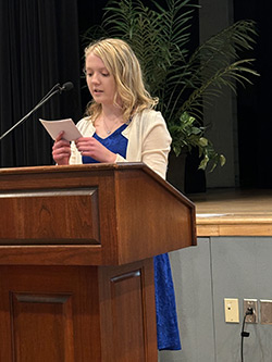 Anna Stewart speaking to her fellow graduates at the Project SEARCH completion ceremony.
