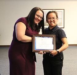 Graduate Robin Keller (right) poses for a photo with Jessica Klemens