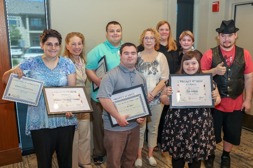 DWD Assistant Deputy Secretary Jennifer Sereno poses with Project SEARCH graduates and instructors at Marquardt Village in Watertown.